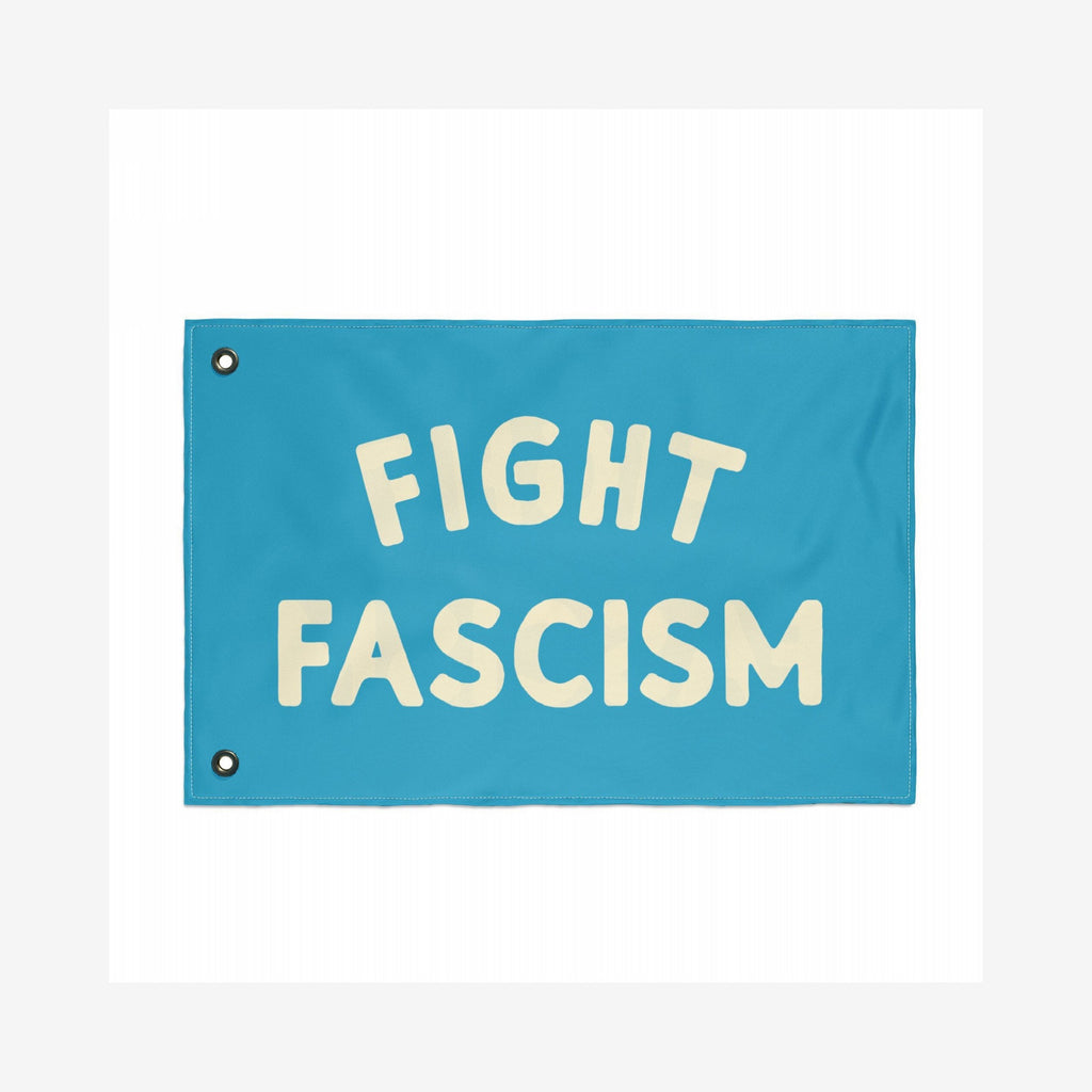 The Fight Fascism Flag features bold cream lettering on a teal background, with metal grommets for easy hanging, embodying a strong anti-fascist message for activism and community events.