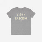 Heather-gray Fight Fascism T-shirt with large, distressed off-white slogan across chest, embodying anti-fascist protest spirit. Small brand name beneath slogan. Ideal for marches and activism.