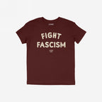 Fight Fascism T-shirt in deep burgundy with distressed off-white text. Bold statement design featuring large FIGHT FASCISM message and smaller brand tagline, embodying protest and resistance ethos.