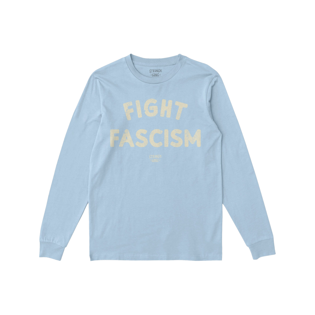 The Fight Fascism T-shirt features FIGHT FASCISM in large cream distressed letters on light-blue fabric, with subtle branding