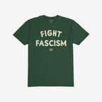 Dark green Fight Fascism T-shirt with large off-white distressed block letters across the chest, symbolizing anti-fascist protest. The smaller brand name appears beneath the main slogan.