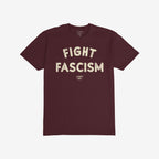 Fight Fascism T-shirt in deep burgundy with distressed off-white text across the chest, designed for anti-fascist activism. Short-sleeve, crew-neck style, ideal for protests and advocating social justice.