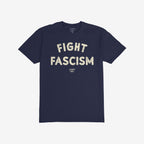 Dark/navy-blue Fight Fascism T-shirt with bold, cream, distressed text conveying an anti-fascist message. The design includes the brand name underneath, highlighting activism and resistance. Ideal for marches and activism.