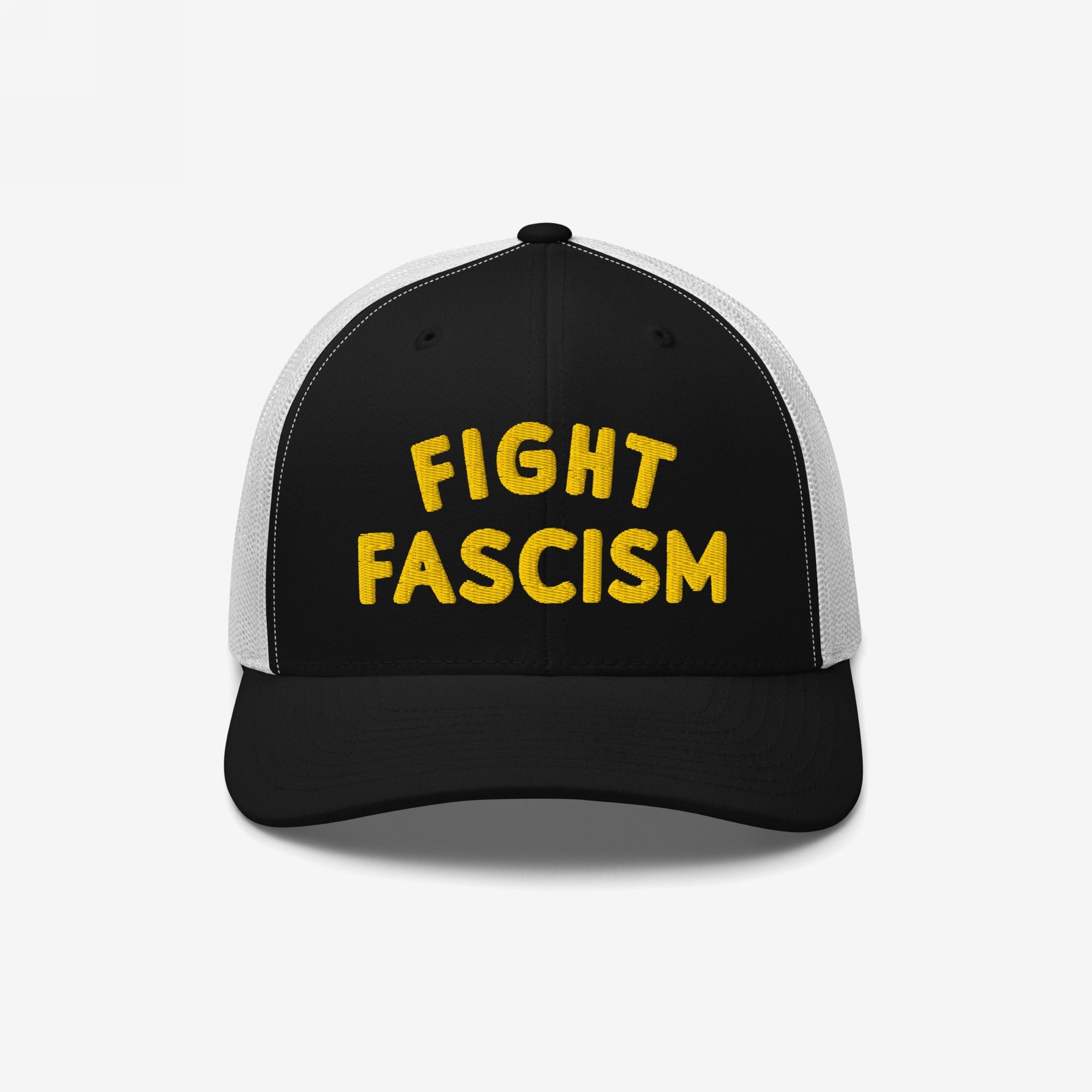 Trucker-style black-and-white Fight Fascism Hat with bold yellow embroidery. Ideal for protests or daily wear, aligning with anti-fascist and equality messages.