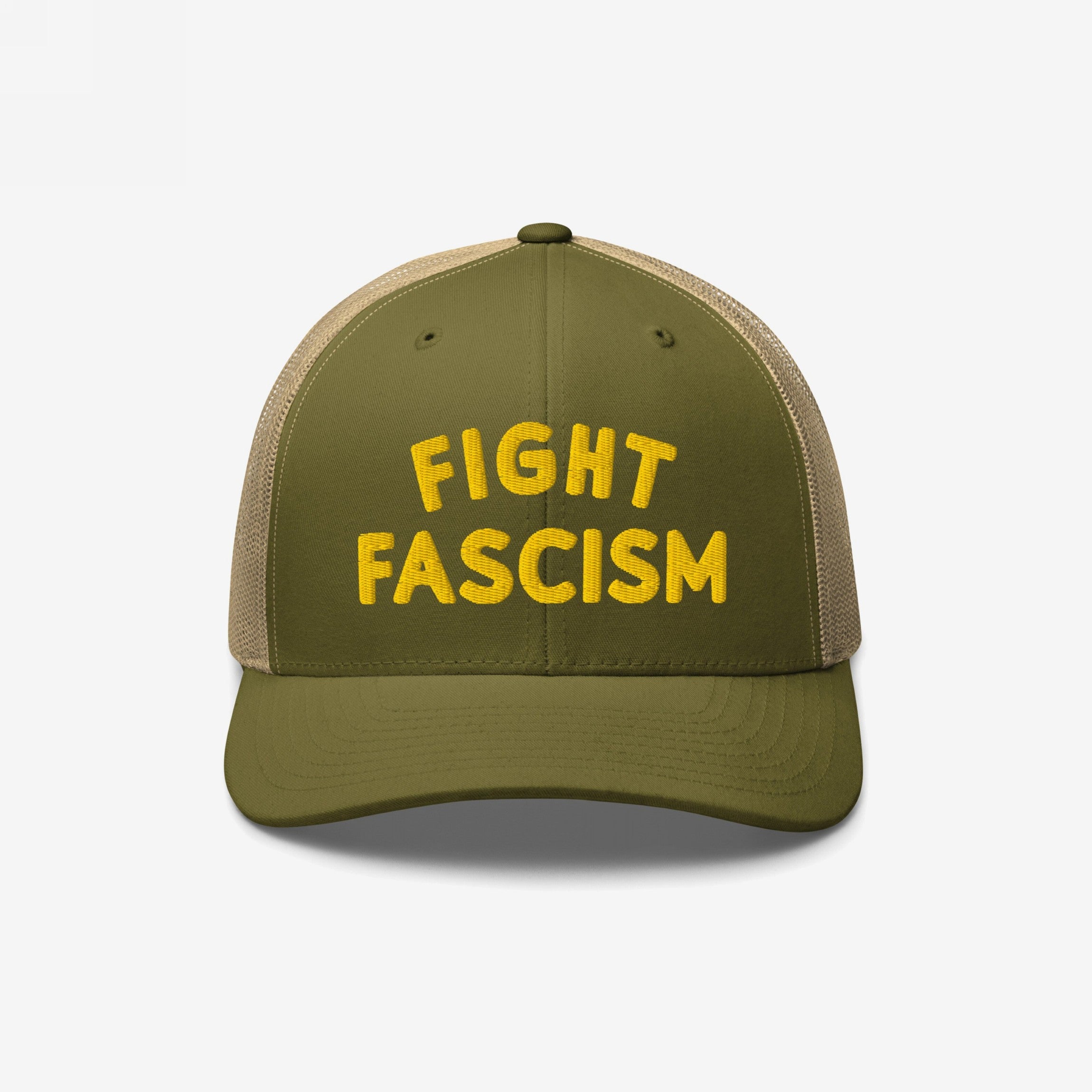 Olive-green trucker-style baseball cap with a tan mesh back, featuring FIGHT FASCISM embroidered in bold yellow letters, designed for anti-fascist activism and visibility.