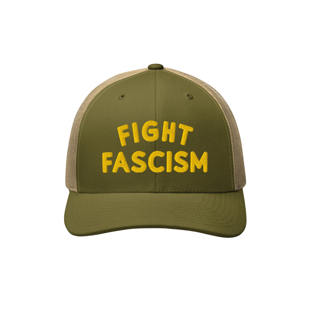 Olive-green trucker-style baseball cap with a tan mesh back, featuring FIGHT FASCISM embroidered in bold yellow letters, desi