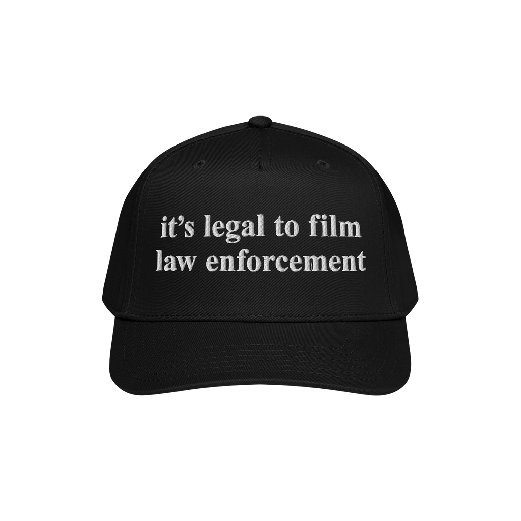 Film The Police Hat features a black baseball cap with white embroidered text stating, “it’s legal to film law enforcemen