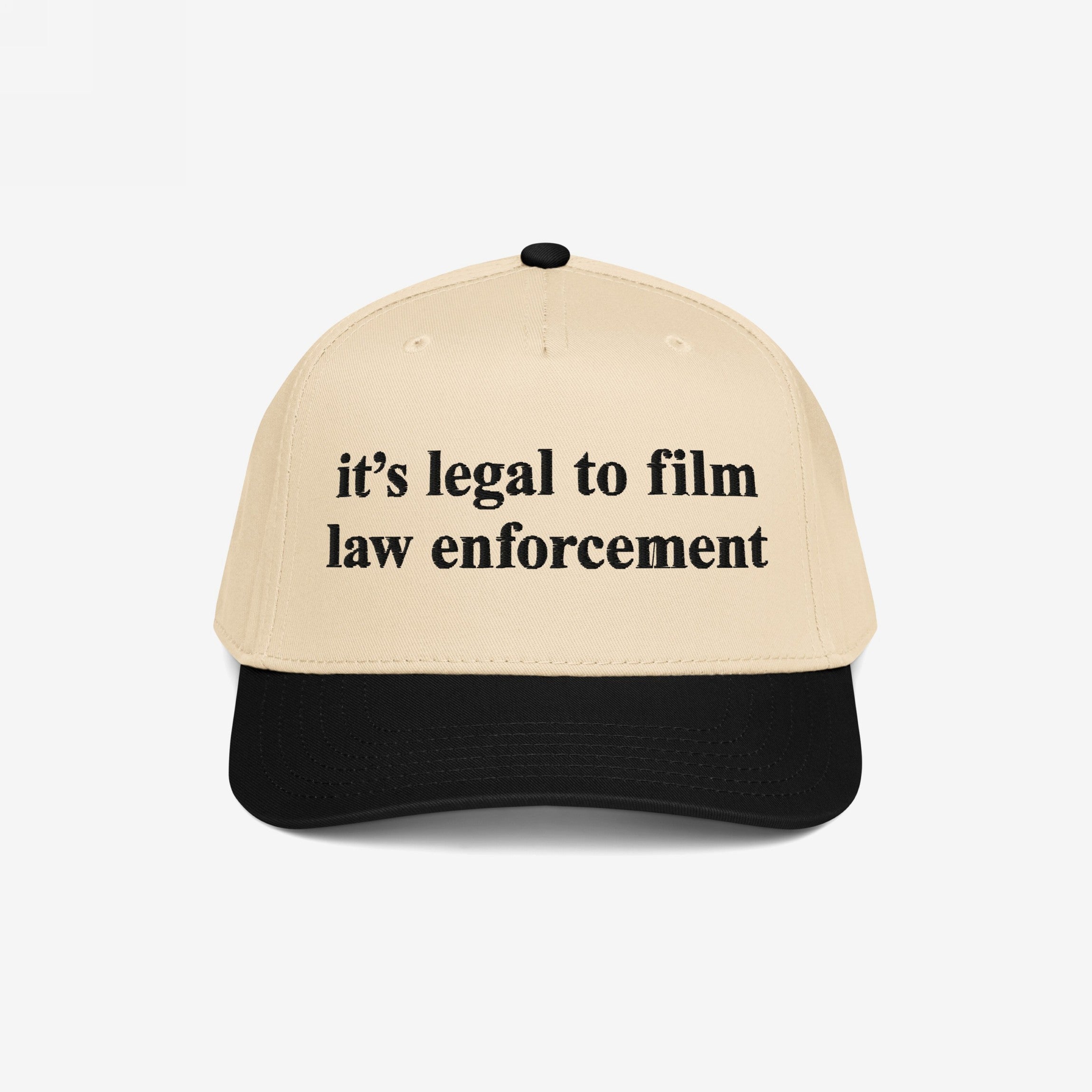Film The Police Hat featuring a light tan front and black bill, boldly stating “it’s legal to film law enforcement.” A statement piece reflecting the fight for police accountability and rights awareness.