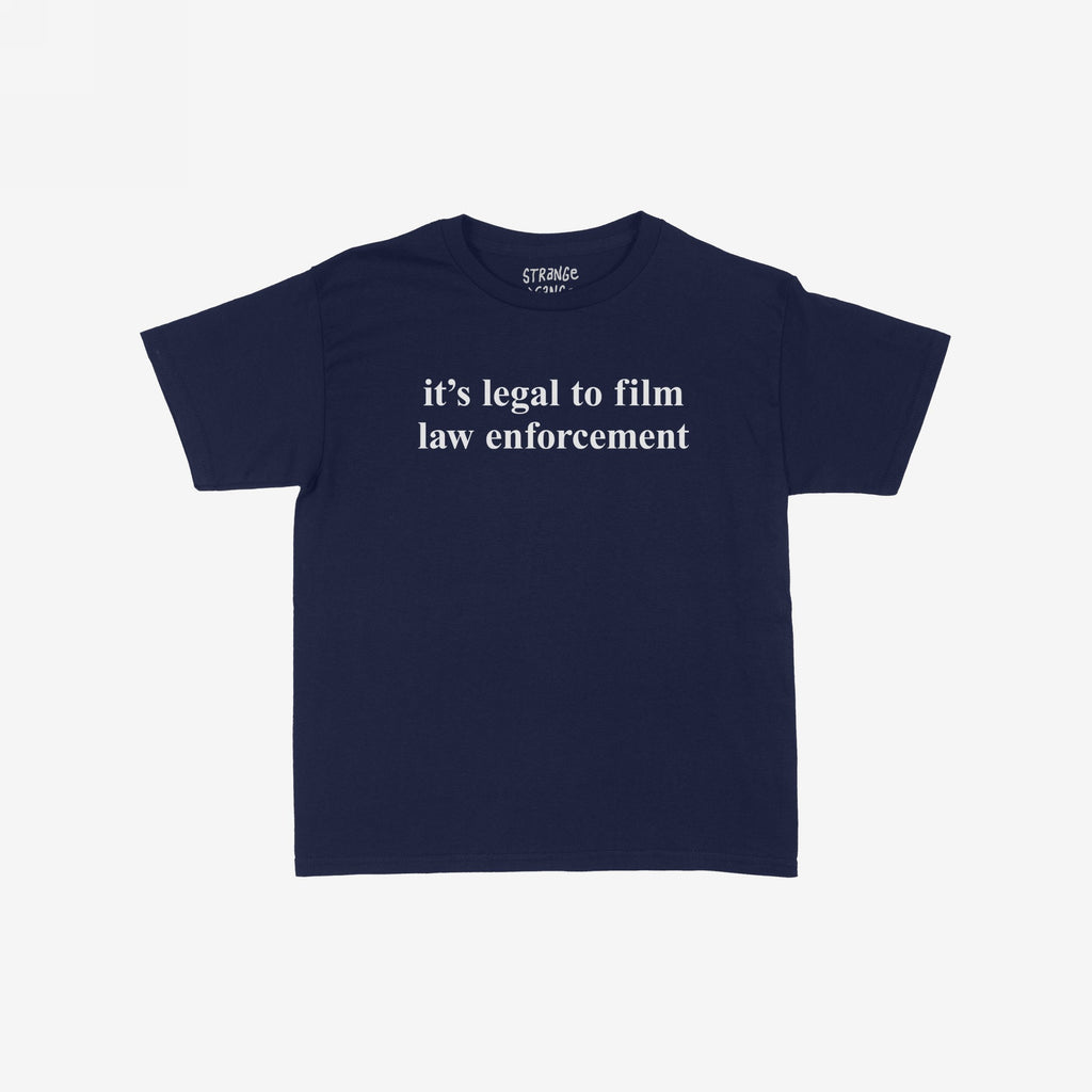 Film The Police Women's Baby Tee in dark-navy, featuring “it’s legal to film law enforcement” in white text. This cropped tee promotes police accountability, aligning with equality and rights advocacy.
