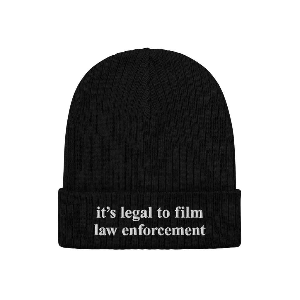 Film The Police Hat: Black knit beanie with folded cuff, featuring embroidered text “it’s legal to film law enforcement.�
