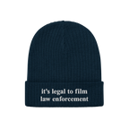 Film The Police Hat: A dark navy-blue ribbed knit beanie featuring white embroidered text it’s legal to film law enforcemen