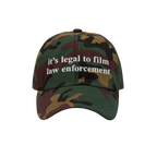 Camouflage-pattern baseball cap with white it’s legal to film law enforcement embroidery. The Film The Police Hat emphasize