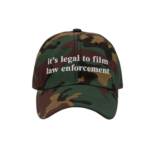 Camouflage-pattern baseball cap with white it’s legal to film law enforcement embroidery. The Film The Police Hat emphasize