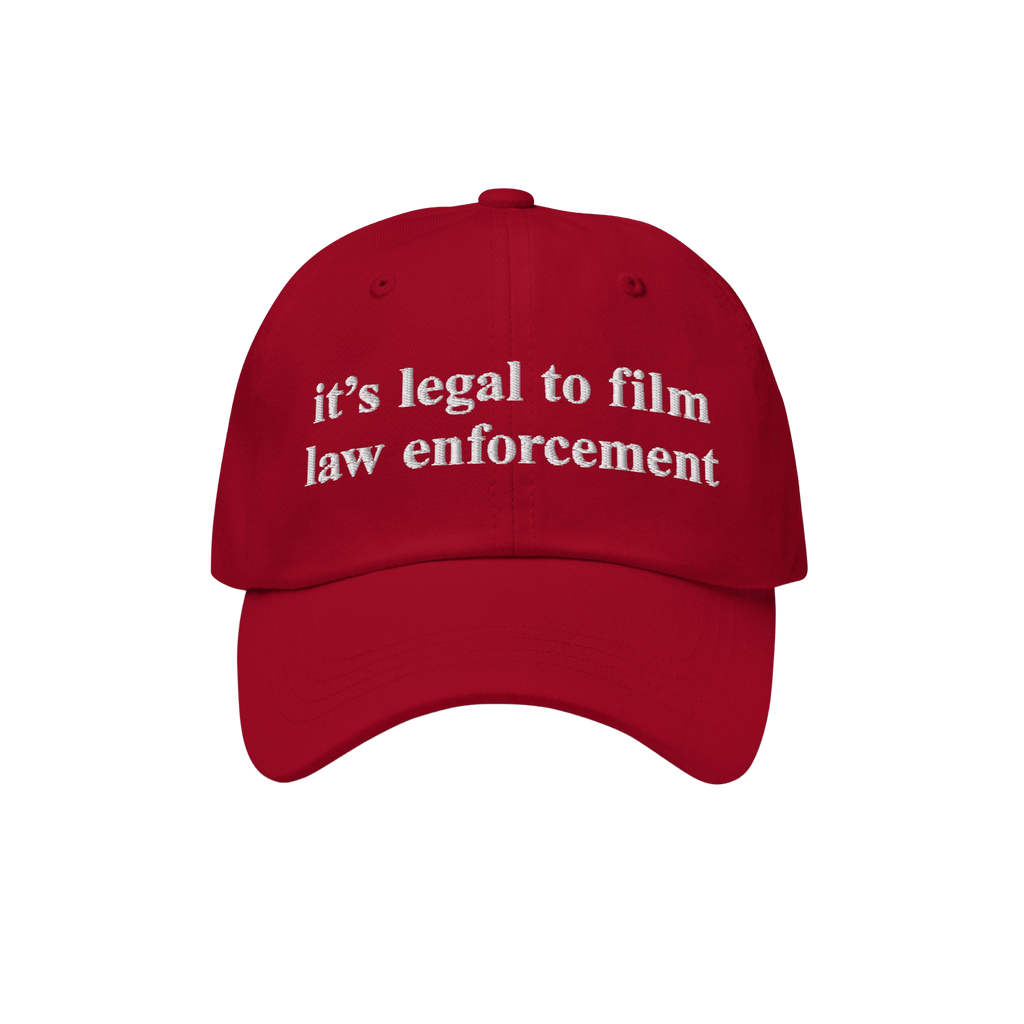 Red Film The Police Hat with white embroidered text, “it’s legal to film law enforcement,” designed for those advocatin