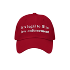 Red Film The Police Hat with white embroidered text, “it’s legal to film law enforcement,” designed for those advocatin