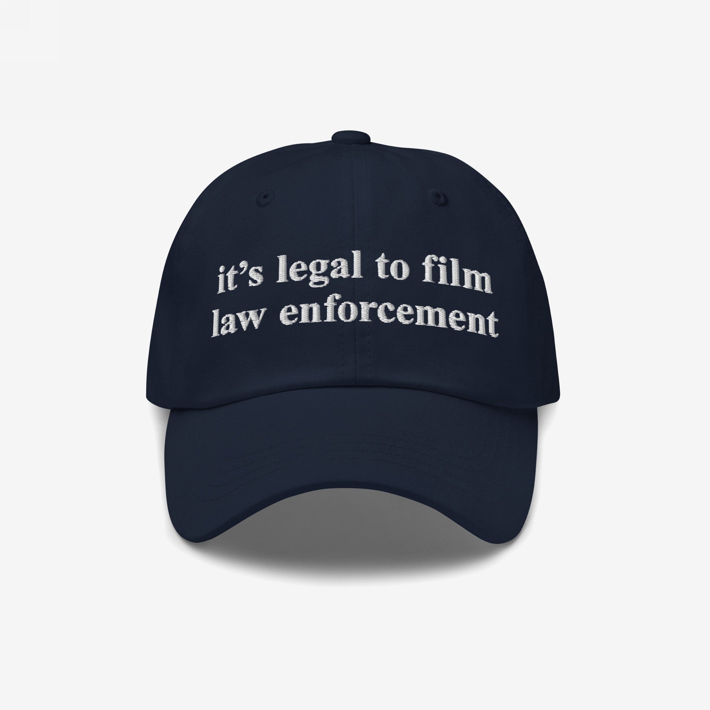 Film The Police Hat: A navy-blue dad hat featuring white embroidered text, it’s legal to film law enforcement, embodying a bold statement on police accountability and individual rights.