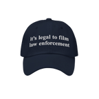 Film The Police Hat: A navy-blue dad hat featuring white embroidered text, it’s legal to film law enforcement, embodying a 