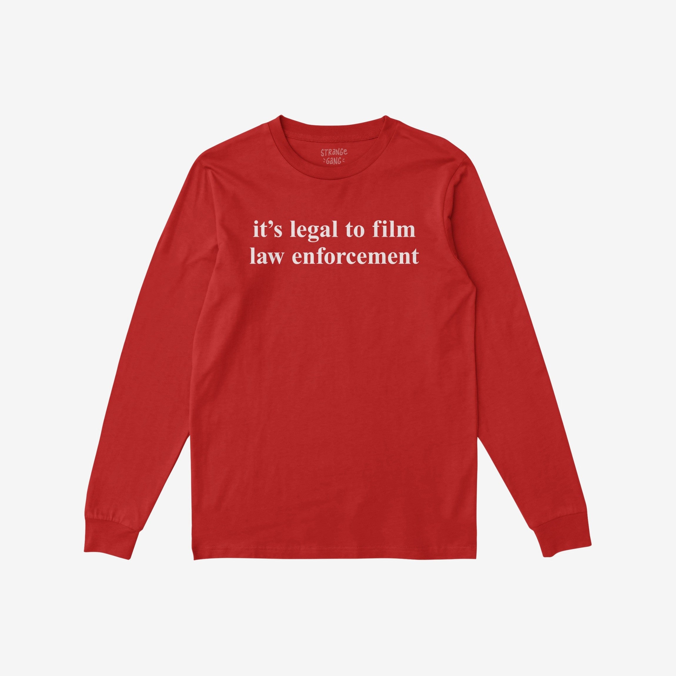 Red long-sleeve Film The Police T-shirt featuring it's legal to film law enforcement text on chest; label visible in neckline. Reflects advocacy for rights and equality.