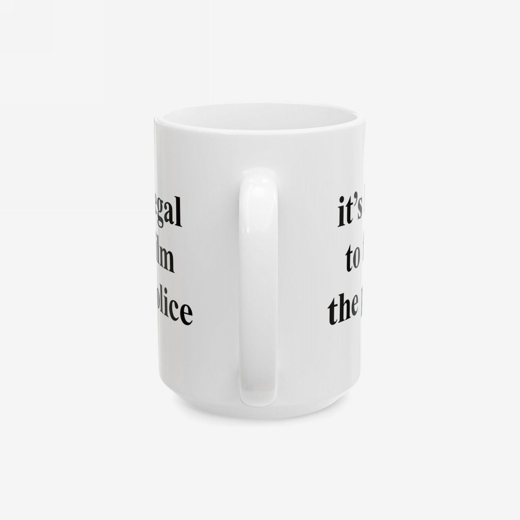 Film The Police Mug in white ceramic with black serif text partially visible; handle centered. Available in 11 oz. and 15 oz.; dishwasher and microwave safe, embodying protest energy.