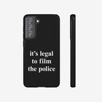 Film The Police Samsung Tough Phone Case: Black case with white slogan “it’s legal to film the police.” Fits Galaxy S21-S25 Ultra models, emphasizing rights awareness, supporting wireless charging.