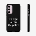 Film The Police Samsung Tough Phone Case: Black case for triple-lens Samsung Galaxy models, featuring bold white text it's legal to film the police. Supports wireless charging, ideal for advocating rights and capturing critical moments.