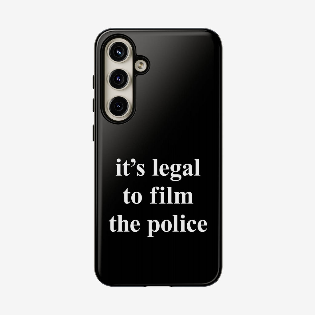 Film The Police Samsung Tough Phone Case: Back view of a smartphone showcasing a triple-lens camera and a glossy black case with “it’s legal to film the police” printed in bold white text.