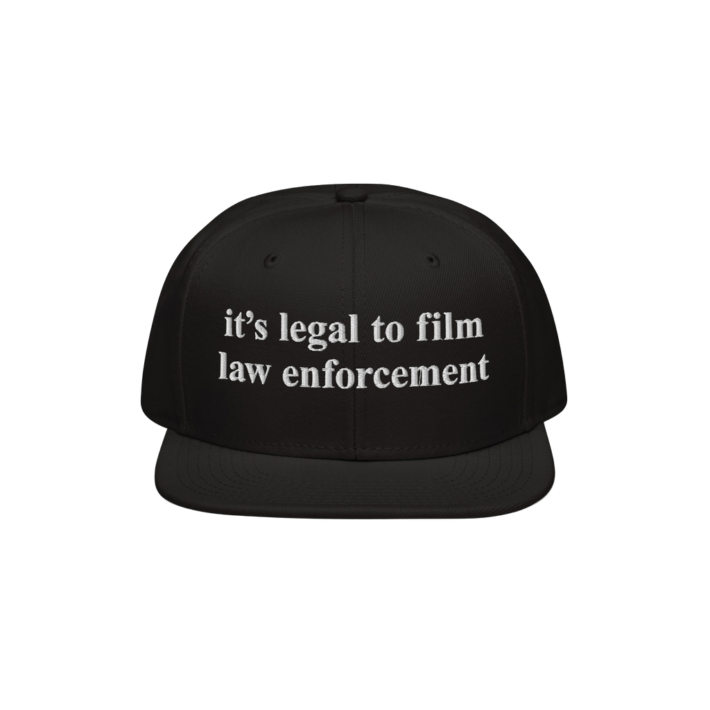 Black Film The Police Hat with flat brim, featuring white embroidered text it’s legal to film law enforcement. Designed for