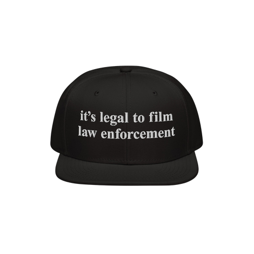 Black Film The Police Hat with flat brim, featuring white embroidered text it’s legal to film law enforcement. Designed for