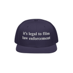 Film The Police Hat features a dark-blue, flat-brimmed design with white embroidered text stating it’s legal to film law en