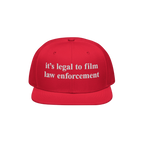 Film The Police Hat with a bright red, flat-brimmed design features white embroidered text stating it’s legal to film law e