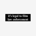 Film The Police Sticker & Magnet displays bold white text on a black rectangle, emphasizing the legality of filming law enforcement. Available as a vinyl sticker or magnet, promoting police accountability and rights awareness.