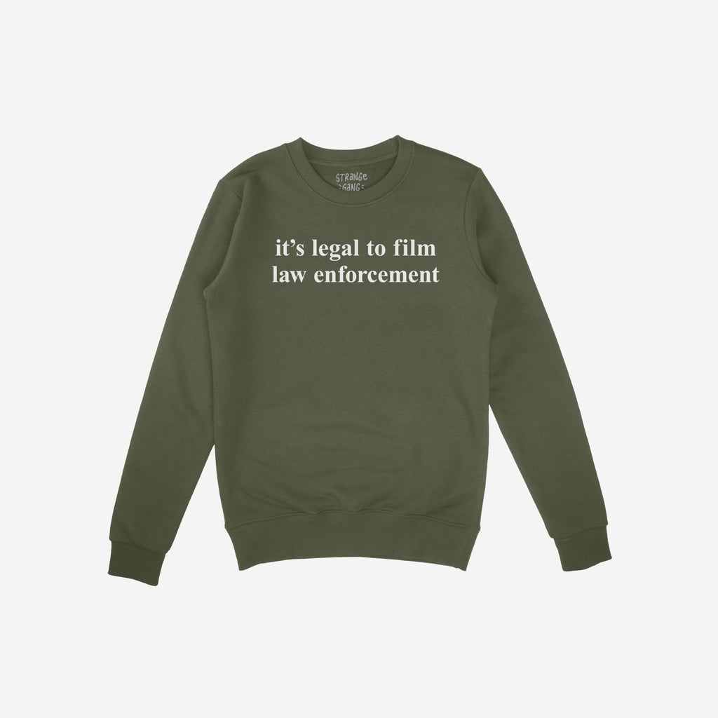 The Film The Police Crewneck Sweatshirt features white text declaring it's legal to film law enforcement on an olive-green backdrop, embodying a message of activism and empowerment.