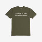 Olive-green Film The Police T-shirt, featuring “it’s legal to film law enforcement” in white serif text on front, embodies defiance and advocacy, fitting slightly slim for a bold, activist look.