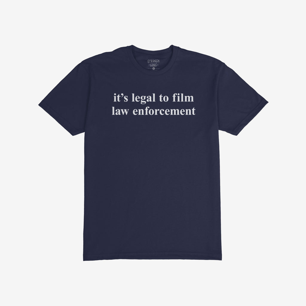The Film The Police T-shirt features bold white text stating it's legal to film law enforcement on a navy-blue background, embodying a message of activism and awareness.