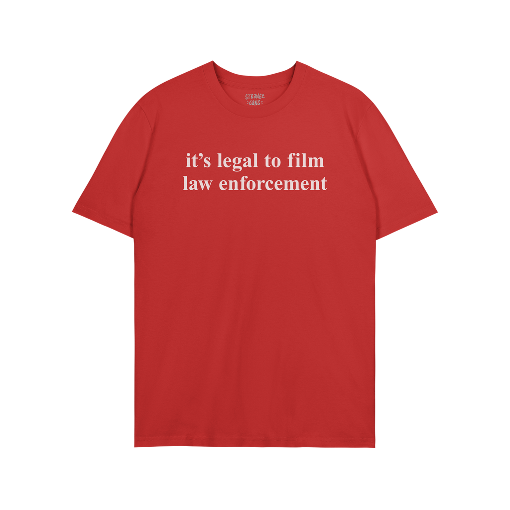 Film The Police T-shirt featuring bold white text stating it's legal to film law enforcement on a plain red background, embod