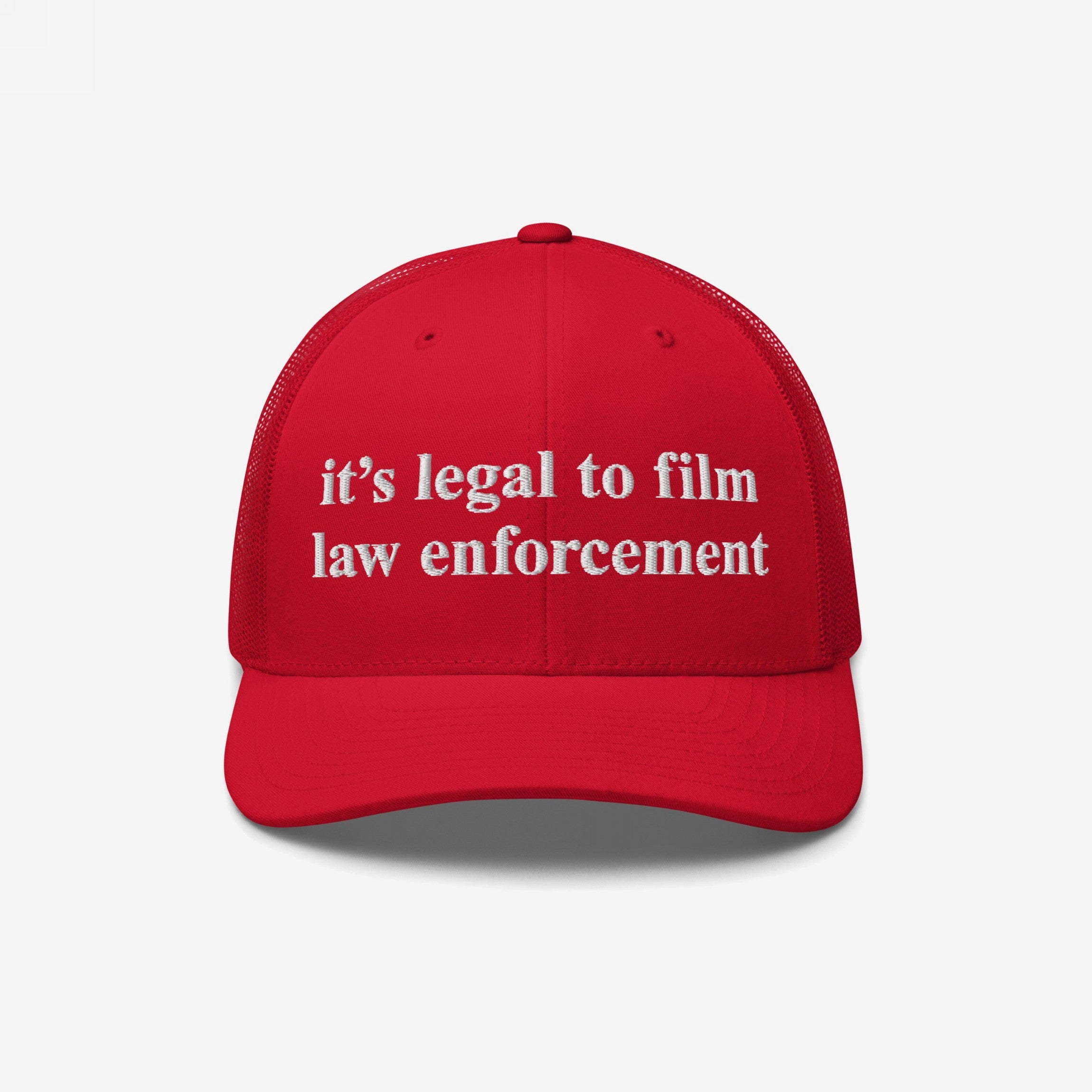 Red mesh-back trucker cap with white embroidered it’s legal to film law enforcement text. The Film The Police Hat embodies protest spirit and police accountability awareness, ideal for rights-conscious individuals.