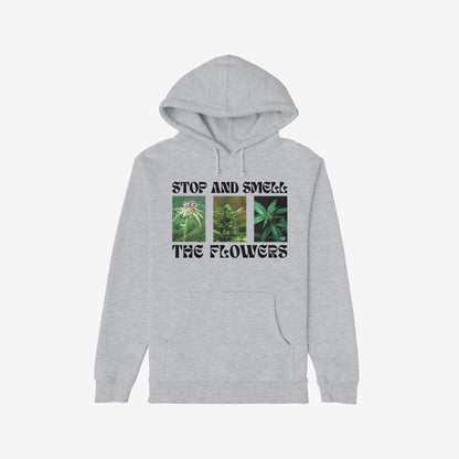 Flowers Hoodie & Sweatshirt featuring a bold graphic of flowering cannabis plants with STOP AND SMELL THE FLOWERS text, front kangaroo pocket, and hood drawstrings; perfect for unapologetic plant enthusiasts.