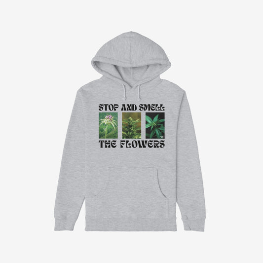 Flowers Hoodie & Sweatshirt featuring a bold graphic of flowering cannabis plants with STOP AND SMELL THE FLOWERS text, front kangaroo pocket, and hood drawstrings; perfect for unapologetic plant enthusiasts.