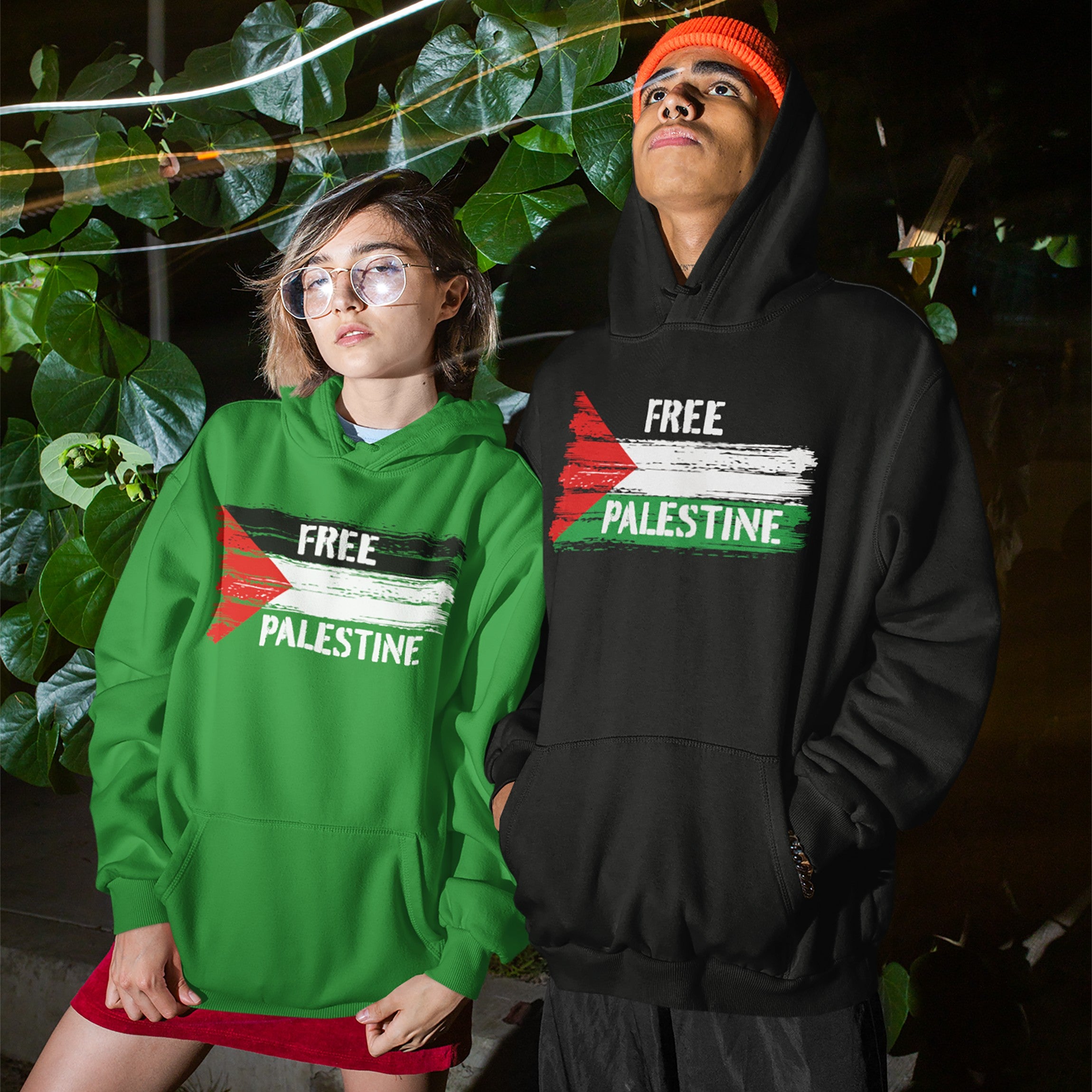 Two individuals wear Free Palestine hoodies featuring a distressed Palestinian flag, embodying activism and resistance. The collection supports justice and liberation, suitable for various settings and advocating equality.