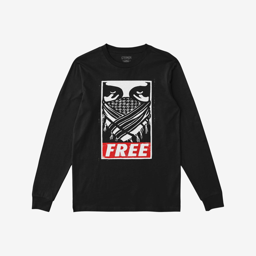 Free Palestine JULZ T-shirt featuring a black-and-white illustrated face wrapped in a patterned scarf, with crossed arms, and the bold word FREE in a red rectangle below.