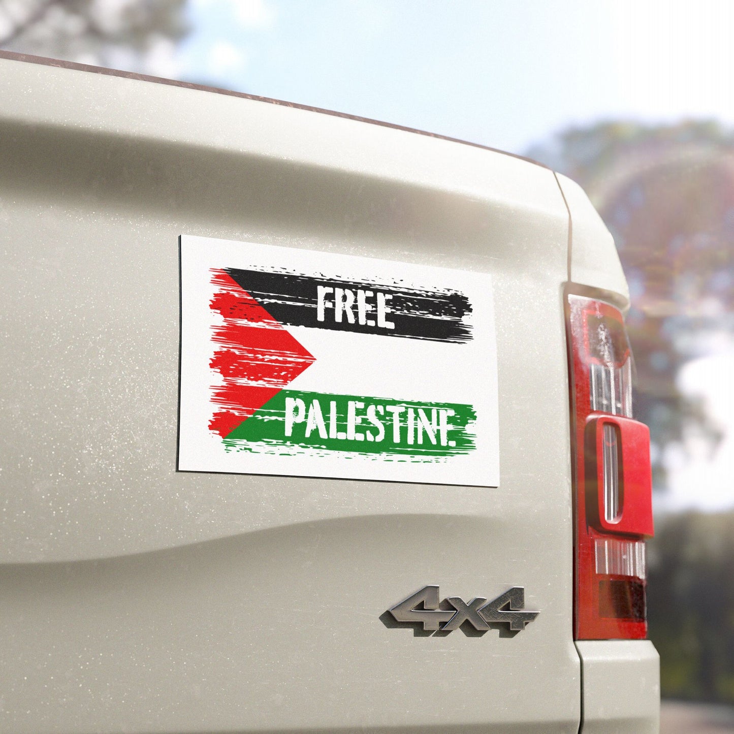 Free Palestine Magnet on a 4x4 pickup truck tailgate, showcasing a message of solidarity with distressed black, red, and green strokes, inspired by the Palestinian flag, advocating justice and liberation.