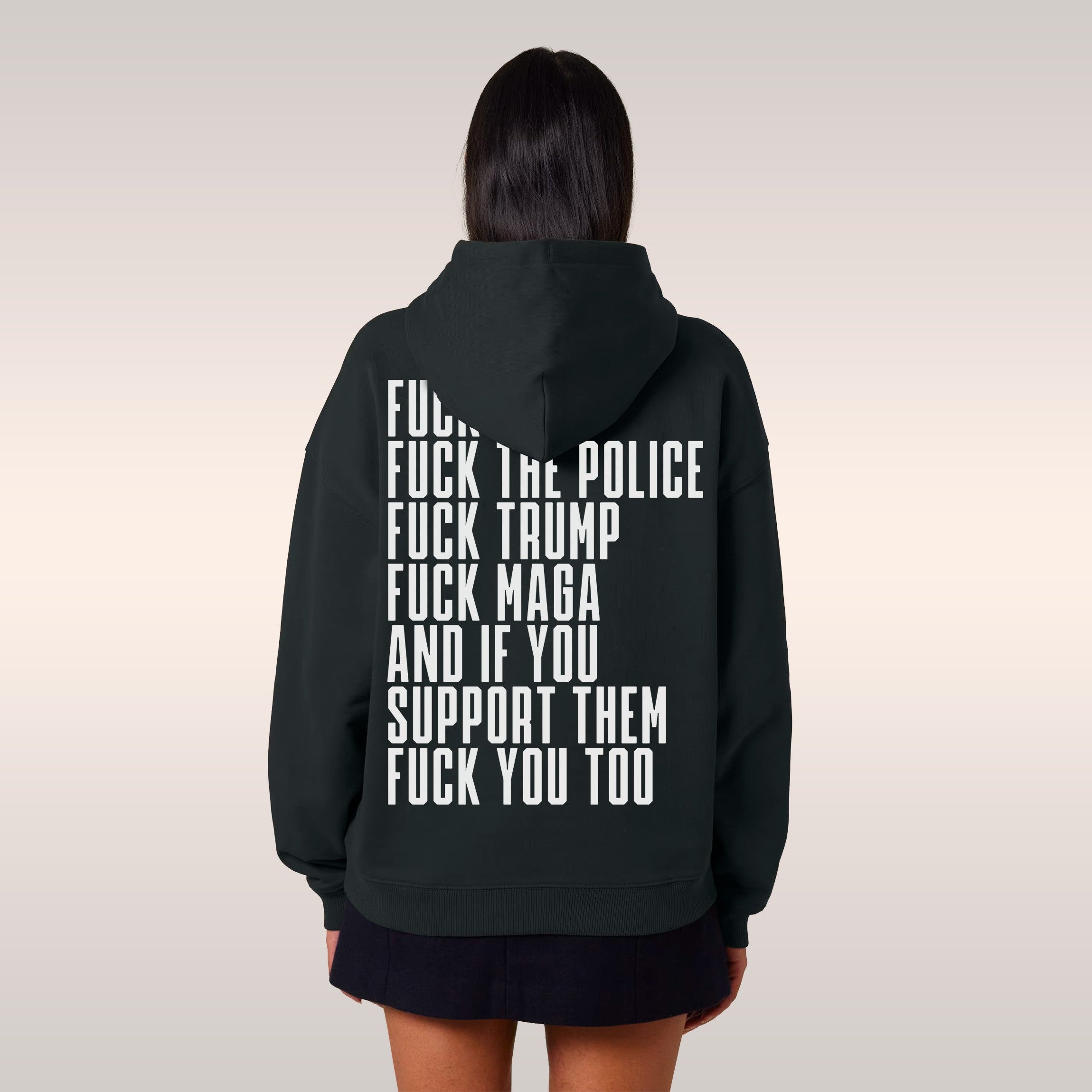 Back view of a person wearing the Fuck 'Em All Back Print Shirt, featuring bold protest text against ICE, police, and Trump.