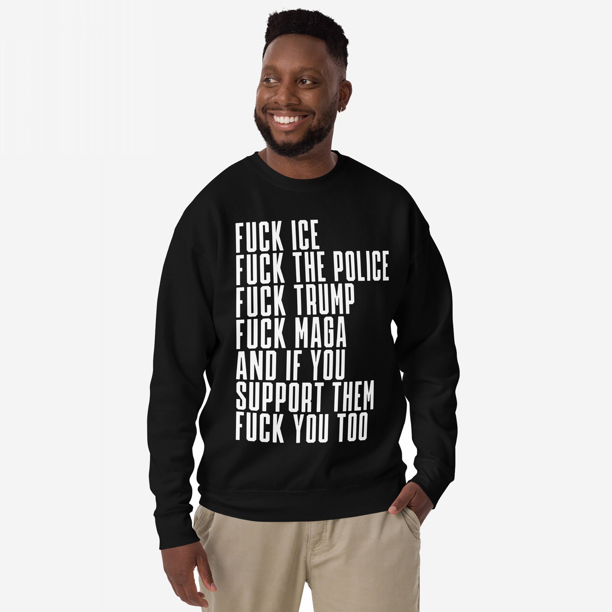 Smiling man wears the Fuck 'Em All Sweatshirt, featuring bold white text condemning ICE, police, Trump, MAGA, and supporters. A statement piece for those passionately opposing injustice.