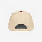 Rear view of the FUCK ICE Hat, featuring bold 3D puff embroidery. This beige baseball cap has six stitched panels, a red top button, and an adjustable snap-closure strap, embodying outspoken values.