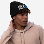 Young man wearing a FUCK ICE Hat, a black knit beanie with bold 3D puff embroidery, embodying strong anti-establishment values. Perfect for standing up against injustice and making a statement.