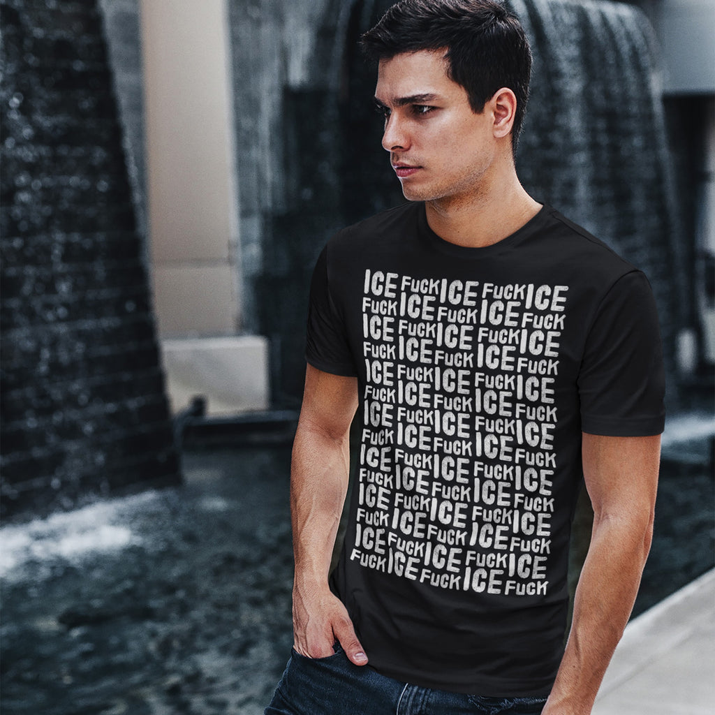 Young man wearing a Fuck ICE Pattern T-shirt stands before a tiered fountain. The shirt's front features a bold, dense repetition of the slogan, emphasizing a strong political stance.