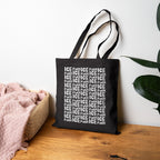 The Fuck ICE Pattern Tote Bag features a bold FUCK ICE design in white block letters, printed on black canvas, embodying protest and advocacy against ICE.