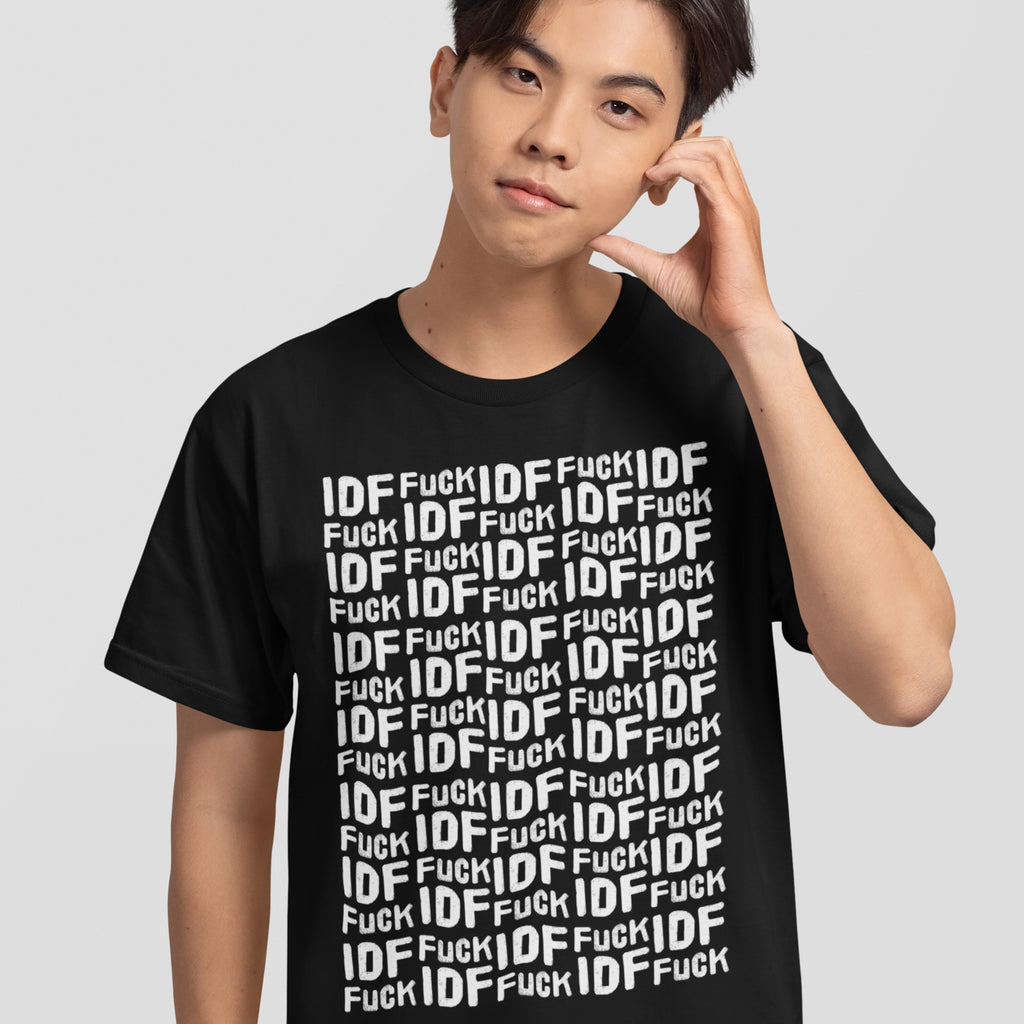 Young man wearing the Fuck IDF Pattern T-shirt, featuring bold white-letter text against black fabric, symbolizing support for Palestine and opposition to IDF, standing against a plain background.