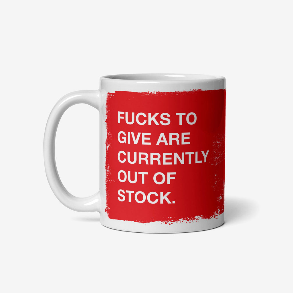 Fucks To Give Mug featuring bold white text on a red square, expressing defiance with FUCKS TO GIVE ARE CURRENTLY OUT OF STOCK. Perfect for showcasing your unapologetic attitude in ceramic form.