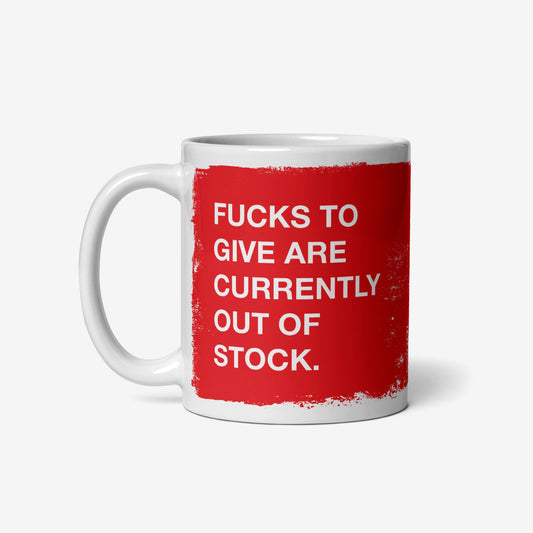 Fucks To Give Mug featuring bold white text on a red square, expressing defiance with FUCKS TO GIVE ARE CURRENTLY OUT OF STOCK. Perfect for showcasing your unapologetic attitude in ceramic form.